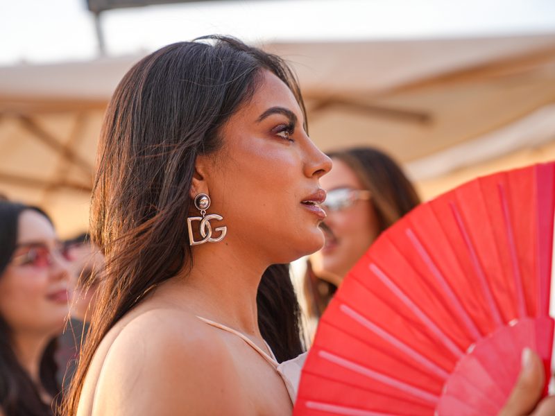 Portrait photography in Morocco — Profile portrait with a red fan